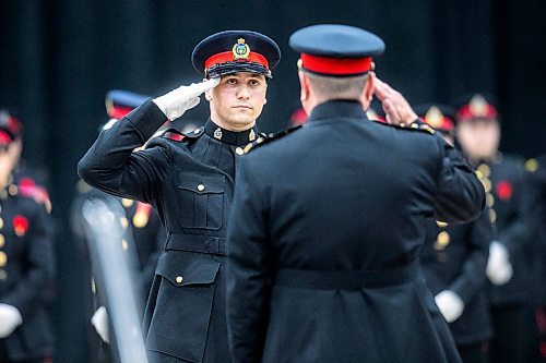 MIKAELA MACKENZIE / FREE PRESS
	
Graduate Joseph Masi salutes acting police chief Gene Bowers during the graduation ceremony for the Winnipeg Police Service recruit class 170 at the RBC Convention Centre in Winnipeg on Friday, Nov. 1, 2024.

Standup.
Winnipeg Free Press 2024