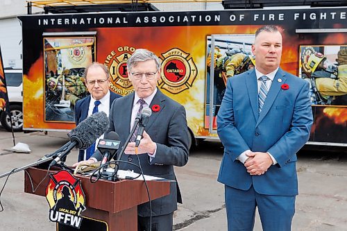 MIKE DEAL / FREE PRESS
Terry Duguid (centre), MP for Winnipeg South and Parliamentary Secretary to the Prime Minister and Special Advisor for Water, talks about the National Framework on Cancers Linked to Firefighting during a press conference at the Winnipeg Fire Paramedic Service Academy (2546 McPhillips St.) Friday morning. Tom Bilous (right), President, UFFW and Kevin Lamoureux (left), MP for Winnipeg North were also on hand to speak to the media.
Reporter: Erik Pindera 
241101 - Friday, November 01, 2024.