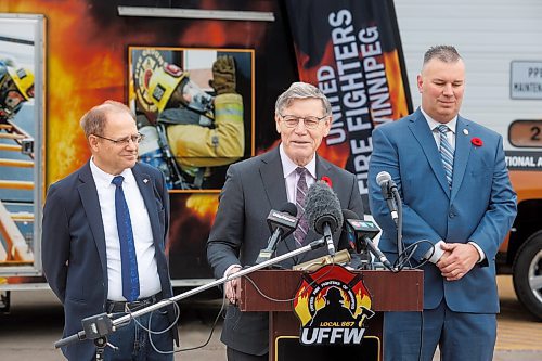 MIKE DEAL / FREE PRESS
Terry Duguid (centre), MP for Winnipeg South and Parliamentary Secretary to the Prime Minister and Special Advisor for Water, talks about the National Framework on Cancers Linked to Firefighting during a press conference at the Winnipeg Fire Paramedic Service Academy (2546 McPhillips St.) Friday morning. Tom Bilous (right), President, UFFW and Kevin Lamoureux (left), MP for Winnipeg North were also on hand to speak to the media.
Reporter: Erik Pindera 
241101 - Friday, November 01, 2024.