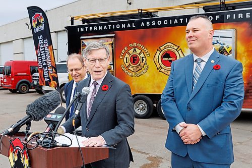 MIKE DEAL / FREE PRESS
Terry Duguid (centre), MP for Winnipeg South and Parliamentary Secretary to the Prime Minister and Special Advisor for Water, talks about the National Framework on Cancers Linked to Firefighting during a press conference at the Winnipeg Fire Paramedic Service Academy (2546 McPhillips St.) Friday morning. Tom Bilous (right), President, UFFW and Kevin Lamoureux (left), MP for Winnipeg North were also on hand to speak to the media.
Reporter: Erik Pindera 
241101 - Friday, November 01, 2024.