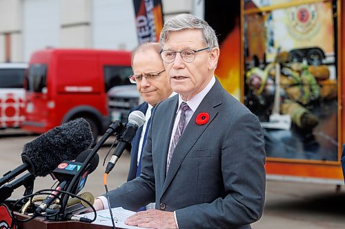 MIKE DEAL / FREE PRESS
Terry Duguid (centre), MP for Winnipeg South and Parliamentary Secretary to the Prime Minister and Special Advisor for Water, talks about the National Framework on Cancers Linked to Firefighting during a press conference at the Winnipeg Fire Paramedic Service Academy (2546 McPhillips St.) Friday morning. Tom Bilous (not pictured), President, UFFW and Kevin Lamoureux (left), MP for Winnipeg North were also on hand to speak to the media.
Reporter: Erik Pindera 
241101 - Friday, November 01, 2024.