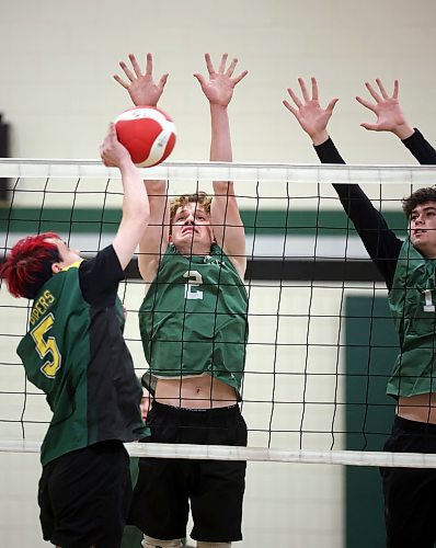 01112024
Owen Falk #2 and Eric Muller #13 of the Neelin Spartans leap to block a spike by Aidan McVicor #5 of the John Taylor Pipers during their varsity match in the 30th Annual Spartan Dig volleyball tournament at &#xc9;cole Secondaire Neelin High School on Friday. Ninety-six high schools are taking part in 276 matches over two days. 
(Tim Smith/The Brandon Sun)