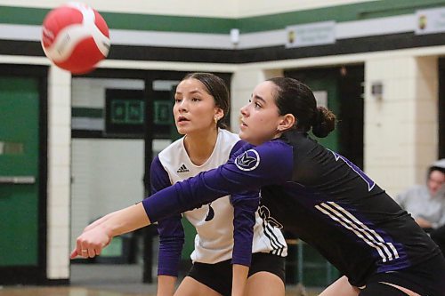 Vincent Massey's Georgia Hall and Hannah McGregor eye the ball in Saturday's final of the Spartan Dig tournament. The final between Massey and Stonewall was the 276th match over the two-day tournament that featured 96 teams. (Matt Packwood/The Brandon Sun)