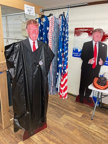 ADAM TREUSCH / FREE PRESS
A cardboard cutout of Donald Trump with a garbage bag over it, in reference to a comment President Joe Biden made, at the Trump Store in Lake Park, Minn.
