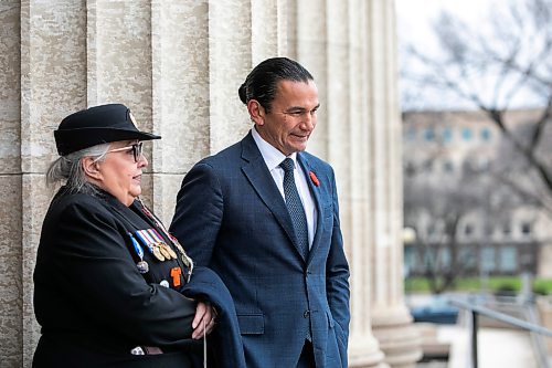 MIKAELA MACKENZIE / FREE PRESS
	
Premier Wab Kinew and Indigenous Veterans Day founder RandiGage stand at the entrance to the Manitoba Legislative Building to greet people after paying their respects to Murray Sinclair at a sacred fire lit inside a teepee in front of the Manitoba Legislative Building in Winnipeg on Monday, Nov. 4, 2024.


Winnipeg Free Press 2024