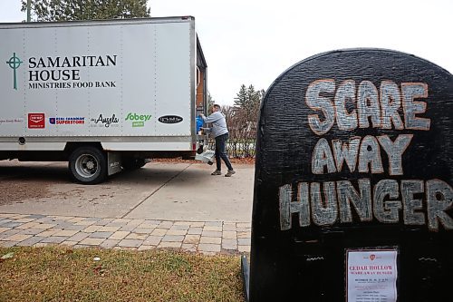 04112024
Marcia Wiebe, food bank coordinator at Samaritan House Ministries' loads nonperishable foods and other donated items into the back of a Samaritan House truck on Monday morning after visitors to the recent Cedar Hollow haunted house on Cedar Bay donated over 1500 items for the food bank along with approximately $300. The Samaritan House Ministries food bank sees demand for approximately 100 hampers per day and up to 150 hampers on busier days. The total number of hampers distributed in 2023 was around 35,000. (Tim Smith/The Brandon Sun)