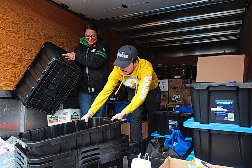 04112024
Carla Mitchell with the Cedar Hollow haunted house on Cedar Bay in Brandon helps Tytan Durgan with Samaritan House Ministries load nonperishable foods and other donated items into the back of a Samaritan House truck on Monday morning after visitors to the haunted house donated over 1500 items for the food bank along with approximately $300. The Samaritan House Ministries food bank sees demand for approximately 100 hampers per day and up to 150 hampers on busier days. The total number of hampers distributed in 2023 was around 35,000. (Tim Smith/The Brandon Sun)