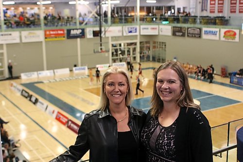 Patty Kinvig (nee Wood), right, and former Brandon University Bobcats teammate Tara Pitz (nee Dale) were inducted into the BU Sports Wall of Fame on Saturday after catching Friday's Canada West basketball season opener. (Thomas Friesen/The Brandon Sun)