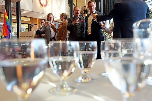 Dignitaries including Brandon Mayor Jeff Fawcett (second from left) make a toast with glasses of water during an announcement at Brandon City Hall on Tuesday. The City of Brandon and Fusion Credit Union are partnering with the province and the Canada Infrastructure Bank for water and wastewater infrastructure projects. (Tim Smith/The Brandon Sun)