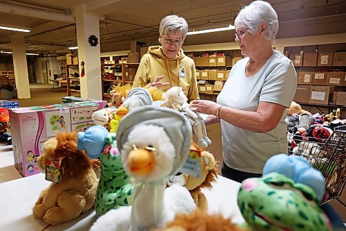 Mieke Bartlette and Linda Gillis sort through toys donated by Toymasters on 18th Street at the Brandon-Westman Christmas Cheer office on Tuesday. Amber Hagans, co-owner of Toymasters, and Braylee Gould, director of operations for the toy store, delivered $4,000 worth of toys to the Brandon-Westman Christmas Cheer Registry on Tuesday. (Tim Smith/The Brandon Sun)