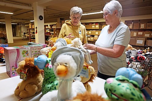 05112024
Mike Bartlette and Linda Gillis sort through toys donated by Toymasters on 18th Street at the Brandon-Westman Christmas Cheer Registry on 7th Street and Rosser Avenue on Tuesday. Bartlette and Gillis coordinate the purchasing of toys for hampers, the wrapping of gifts and the packing of hampers. Amber Hagans, co-owner of Toymasters, and Braylee Gould, director of operations for the toy store, delivered $4000 worth of toys to the Brandon-Westman Christmas Cheer Registry on Tuesday. (Tim Smith/The Brandon Sun)