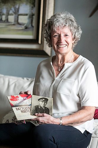 MIKAELA MACKENZIE / FREE PRESS
	
Carol Ellerbeck, who went on the In Our FathersՠFootsteps trip to the Netherlands in 2022, with photos of her late father Bob Ellerbeck (who served during WW2) on Wednesday, Nov. 6, 2024.

For Kevin story.
Winnipeg Free Press 2024