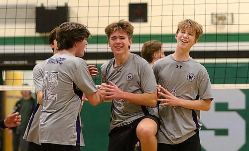 Ryder Hrubeniuk, centre, celebrates with his Vincent Massey Vikings teammates after scoring the match-winning point at Neelin on Wednesday to force a deciding third match in the Brandon High School Volleyball League junior varsity boys' final. (Thomas Friesen/The Brandon Sun)