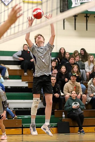 Samuel Redekop sets a ball during the fourth set. (Thomas Friesen/The Brandon Sun)