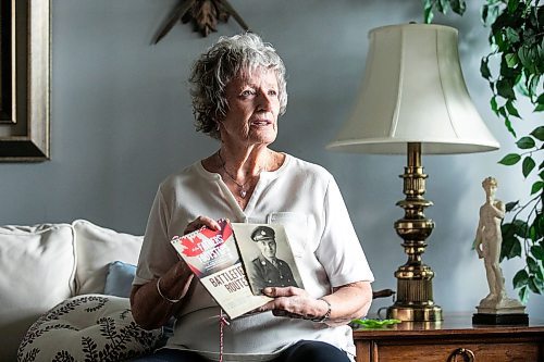 MIKAELA MACKENZIE / FREE PRESS
	
Carol Ellerbeck, who went on the In Our Fathers&#x560;Footsteps trip to the Netherlands in 2022, with photos of her late father Bob Ellerbeck (who served during WW2) on Wednesday, Nov. 6, 2024.

For Kevin story.
Winnipeg Free Press 2024