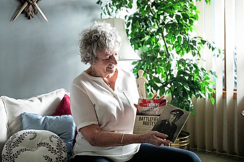 MIKAELA MACKENZIE / FREE PRESS
	
Carol Ellerbeck, who went on the In Our Fathers&#x560;Footsteps trip to the Netherlands in 2022, with photos of her late father Bob Ellerbeck (who served during WW2) on Wednesday, Nov. 6, 2024.

For Kevin story.
Winnipeg Free Press 2024