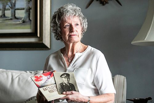 MIKAELA MACKENZIE / FREE PRESS
	
Carol Ellerbeck, who went on the In Our Fathers&#x560;Footsteps trip to the Netherlands in 2022, with photos of her late father Bob Ellerbeck (who served during WW2) on Wednesday, Nov. 6, 2024.

For Kevin story.
Winnipeg Free Press 2024