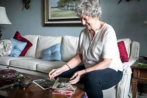 MIKAELA MACKENZIE / FREE PRESS
	
Carol Ellerbeck, who went on the In Our Fathers&#x560;Footsteps trip to the Netherlands in 2022, with photos of her late father Bob Ellerbeck (who served during WW2) on Wednesday, Nov. 6, 2024.

For Kevin story.
Winnipeg Free Press 2024