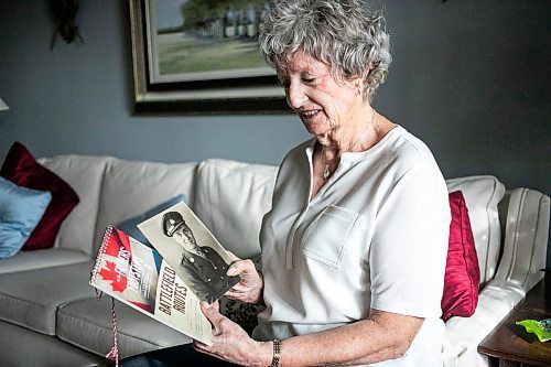 MIKAELA MACKENZIE / FREE PRESS
	
Carol Ellerbeck, who went on the In Our Fathers&#x560;Footsteps trip to the Netherlands in 2022, with photos of her late father Bob Ellerbeck (who served during WW2) on Wednesday, Nov. 6, 2024.

For Kevin story.
Winnipeg Free Press 2024