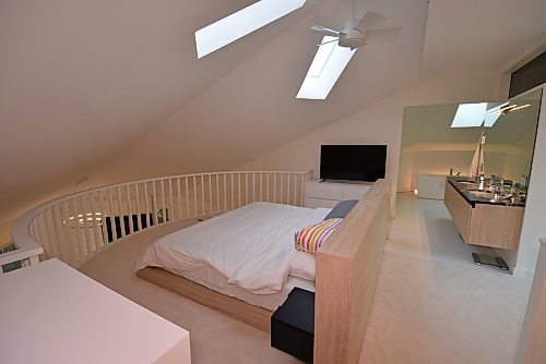 Todd Lewys / Free Press
Unique yet functional, the gorgeous loft-style primary bedroom is the home’s signature space.