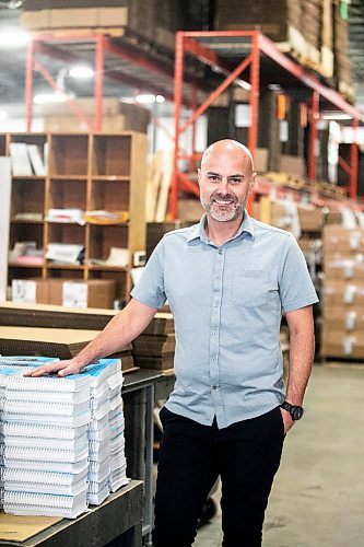 MIKAELA MACKENZIE / FREE PRESS
	
Gateway Group operations manager Rene DesJarlais with coil-bound recipe books in their manufacturing and bookbinding facility in Winnipeg on Thursday, Nov. 7, 2024.

For Aaron Epp story.
Winnipeg Free Press 2024