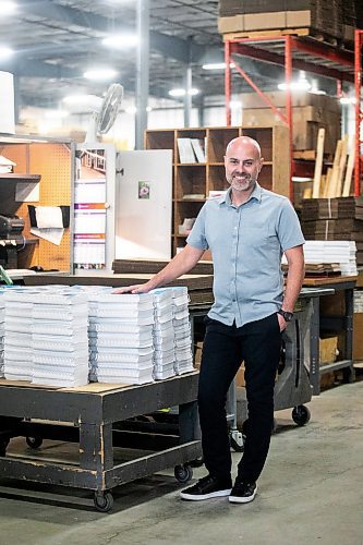 MIKAELA MACKENZIE / FREE PRESS
	
Gateway Group operations manager Rene DesJarlais with coil-bound recipe books in their manufacturing and bookbinding facility in Winnipeg on Thursday, Nov. 7, 2024.

For Aaron Epp story.
Winnipeg Free Press 2024