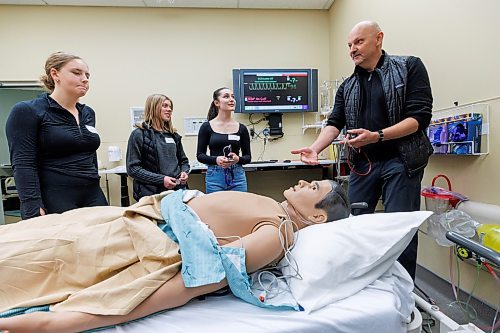 MIKE DEAL / FREE PRESS
(From left) Natalia Lesser from Daniel McIntyre Collegiate Institute, Bethany Wiebe and Dayna Gobeil from Morris School, with Nursing Instructor, Vladan Protudjer during a workshop called, Hands-on Nursing Clinical Skills, as part of the Discovery Day in Health Sciences, a University of Manitoba event. The day long opportunity saw more than 300 students and teachers from 60 high schools from across Winnipeg and surrounding areas converge on the University of Manitoba Bannatyne campus to speak with award-winning faculty members, take part in interactive workshops demonstrating real-world medical skills, and get a clear picture of what it&#x2019;s really like to be a health professional or scientist. 
The Hands-on Nursing Clinical Skills workshop was an immersive workshop designed to enhance the students practical skills across critical areas of patient care. 
Standup
241107 - Thursday, November 07, 2024.