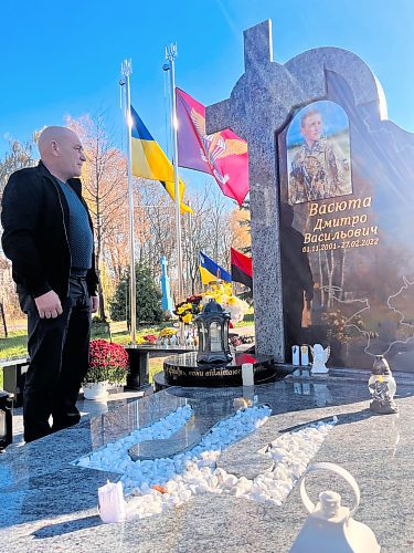 MELISSA MARTIN / FREE PRESS

Vasyl Vasyuta stands beside his son Dmytro&#x2019;s grave in their village of Cherneve, in Western Ukraine. Just 20 years old, Dmytro was one of the first soldiers from the Lviv region to die in combat during the full-scale invasion, and one of the youngest.
