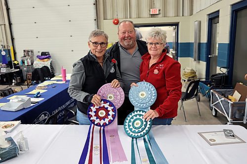 Corinne Walker, Tim Melnyk and Diane Fast were running the show Friday at the administration table. Four medals were up for grabs, for best in show, reserve best in show, best puppy in show and best altered (spayed/neutered) in show. (Photos by Connor McDowell/The Brandon Sun)