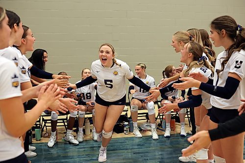 Megan Pickford (5) of the Brandon University Bobcats is cheered on by teammates as she takes to the court for the first set of the Bobcats home-opener against the University of Saskatchewan Huskies at the BU Healthy Living Centre on Friday evening.  
(Photos by Tim Smith/The Brandon Sun)