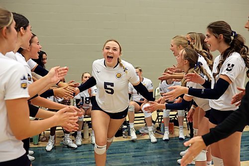 Megan Pickford (5) of the Brandon University Bobcats is cheered on by teammates as she takes to the court for the first set of the Bobcats home-opener against the University of Saskatchewan Huskies at the BU Healthy Living Centre on Friday evening.  
(Photos by Tim Smith/The Brandon Sun)