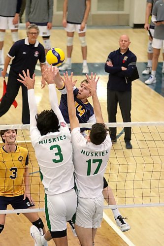 Brandon's Tom Friesen attacks against a Saskatchewan double block during their Canada West men's volleyball match at the Healthy Living Centre on Friday. (Thomas Friesen/The Brandon Sun)