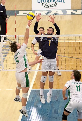 Brandon's JJ Love (1) attempts to block Saskatchewan's Jefferson Morrow during their Canada West men's volleyball match at the Healthy Living Centre on Friday. (Thomas Friesen/The Brandon Sun)