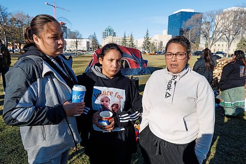 MIKE DEAL / FREE PRESS
(From left) Michelle Houle, Natalie Anderson, and Sage Kent, talk about their plan to stay in Memorial Park for the weekend.
Family and friends of Natalie Anderson, who raised Xavia Butler until she was taken from her by CFS and given back to her biological mother in contravention of an agreement that the two first cousins had made, have set up a sacred fire in Memorial Park and plan to stay there through the weekend in protest.
Xavia Butler was recently identified as the remains that were discovered in June in the Rural Municipality of Grahamdale, about 250 kilometres northwest of Winnipeg.
Reporter: Maggie Macintosh
Note: I was given permission to include the sacred fire in my photos.
241108 - Friday, November 08, 2024.