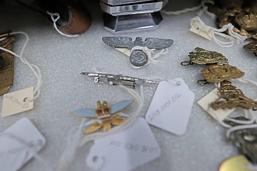 The RCA Museum in CFB Shilo holds thousands of artifacts from the first and second World Wars, many of which were brought home by soldiers following their tours of duty overseas. Among the artifacts in storage at the museum is this German pin bearing the Nazi swastika and eagle. (Matt Goerzen/The Brandon Sun)