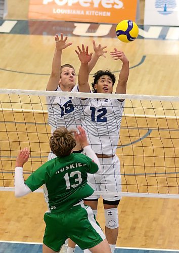 Brandon University imports Philipp Lauter, left, and Sam Chen attempt to block Saskatchewan's Isaiah Mamer during their Canada West men's volleyball match at the Healthy Living Centre on Saturday. (Thomas Friesen/The Brandon Sun)