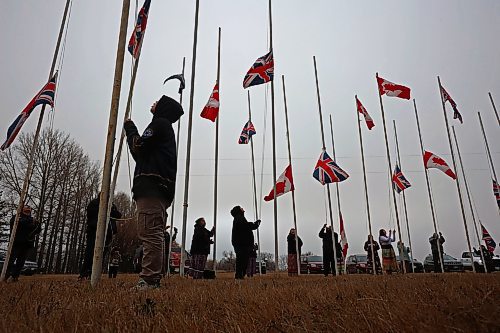 11112024
Community members pitch in to take down the flags that fly at the war memorial at Sioux Valley Dakota Nation&#x2019;s Pow Wow grounds following the Remembrance Day service at the SVDN Community Centre on Monday. The flags are raised for the weekend of Sioux Valley&#x2019;s Pow Wow and then raised again on National Indigenous Veterans Day (November 8) and removed on Remembrance Day. 
(Tim Smith/The Brandon Sun)