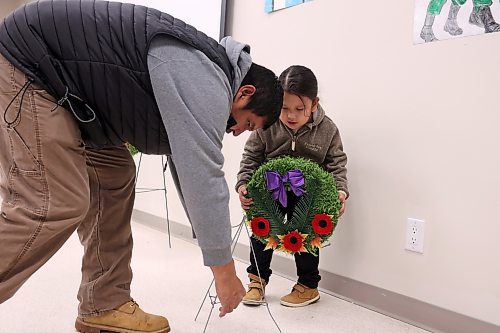 11112024
Danny Bunn and his four-year-old son Danny Bunn Junior place a wreath during the Remembrance Day service at the Sioux Valley Dakota Nation Community Centre on Monday.
(Tim Smith/The Brandon Sun)