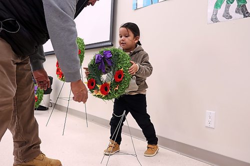 11112024
Danny Bunn and his four-year-old son Danny Bunn Junior place a wreath during the Remembrance Day service at the Sioux Valley Dakota Nation Community Centre on Monday.
(Tim Smith/The Brandon Sun)