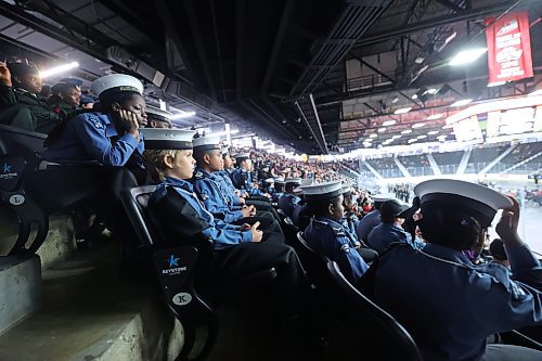 Navy League Cadets watch the rest of the Remembrance Day ceremony from the stands on Monday morning following their time marching into the arena before The Last Post. (Matt Goerzen/The Brandon Sun)