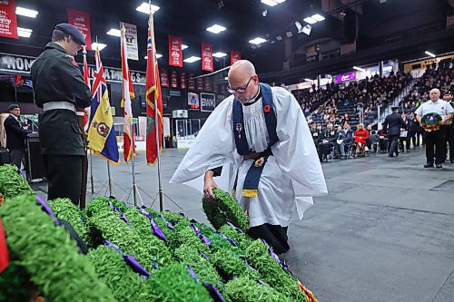 Legion Padre Chris Arthur lays a wreath during the Remembrance Day ceremony at Brandon's Keystone Centre on Monday morning. (Matt Goerzen/The Brandon Sun)