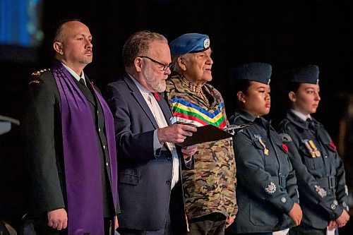 BROOK JONES/FREE PRESS
The Joint Veterans' Association hosts a Remembrance Day Service at the RBC Convention Centre in Winnipeg, Man., Monday, Nov. 11, 2024. This year's service also commemorated the 80th anniversary of D-Day and the Battle of Normandy, the 100th anniversary of the Royal Candian Air Force and the 150th anniversary of the City of Winnipeg. Pictured: The Very Rev. Paul Johnson (second from far left) and Retired Sgt. Winston Wuttunee (middle) are pictured singing a hymm called O God Our Help in Ages past. Also pictured are 17 Wing Chaplain Padre Antin Sloboda (left) and members of the Royal Canadian Air Cadets 573 Andrew Mynarski VC (second from far right and right).