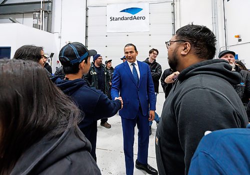 MIKE DEAL / FREE PRESS
Premier Wab Kinew greets employees of StandardAero as he arrives for the press conference.
Premier Wab Kinew, federal Northern Affairs Minister Dan Vandal, minister responsible for Prairies Economic Development Canada, and Economic Development, Investment, Trade and Natural Resources Minister Jamie Moses along with Brent Ostermann, vice-president, product assurance and quality, StandardAero, announce at a press conference held at StandardAero, that the governments of Canada and Manitoba are investing in training for skilled trades and growing Manitoba&#x2019;s economy through support for StandardAero.
Under the Canada-Manitoba Workforce Development Agreement, the governments of Canada and Manitoba say they are going to provide $510,400 from 2024 to 2027 through the Industry Expansion Program to support StandardAero&#x2019;s employee skill development which includes training of 100 new employees and 1,200 current employees.
241112 - Tuesday, November 12, 2024.