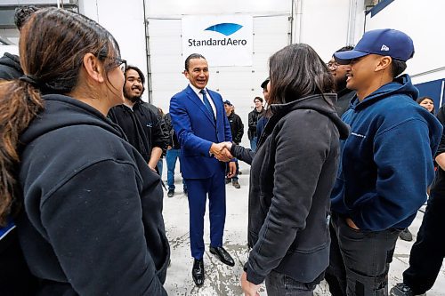 MIKE DEAL / FREE PRESS
Premier Wab Kinew greets employees of StandardAero as he arrives for the press conference.
Premier Wab Kinew, federal Northern Affairs Minister Dan Vandal, minister responsible for Prairies Economic Development Canada, and Economic Development, Investment, Trade and Natural Resources Minister Jamie Moses along with Brent Ostermann, vice-president, product assurance and quality, StandardAero, announce at a press conference held at StandardAero, that the governments of Canada and Manitoba are investing in training for skilled trades and growing Manitoba&#x2019;s economy through support for StandardAero.
Under the Canada-Manitoba Workforce Development Agreement, the governments of Canada and Manitoba say they are going to provide $510,400 from 2024 to 2027 through the Industry Expansion Program to support StandardAero&#x2019;s employee skill development which includes training of 100 new employees and 1,200 current employees.
241112 - Tuesday, November 12, 2024.