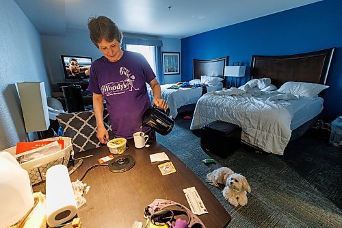 MIKE DEAL / FREE PRESS
Carol Lynch has been living in a hotel since the Birchwood Terrace apartment building was evacuated six months ago. She is in a kitchenette with her dog Trixie. The province is still paying for rooms for at least a handful of evacuees. Lynch said she will return to her suite at Birchwood Terrace when the building is deemed safe again. She said Ladco should be covering hotel costs, not the province.
Reporter: Chris Kitching 
241112 - Tuesday, November 12, 2024.