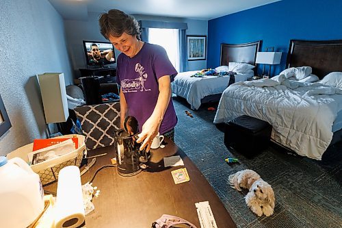 MIKE DEAL / FREE PRESS
Carol Lynch has been living in a hotel since the Birchwood Terrace apartment building was evacuated six months ago. She is in a kitchenette with her dog Trixie. The province is still paying for rooms for at least a handful of evacuees. Lynch said she will return to her suite at Birchwood Terrace when the building is deemed safe again. She said Ladco should be covering hotel costs, not the province.
Reporter: Chris Kitching 
241112 - Tuesday, November 12, 2024.