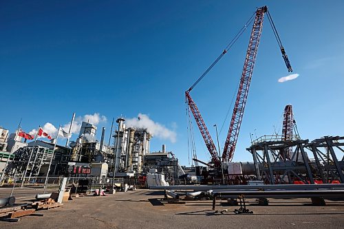 Large cranes are in place as work is done to get ready for the installation of a new 393-metric-ton convertor at Koch Fertilizer’s Brandon plant on Wednesday. A portion of the convertor is expected to be lifted into place by the enormous cranes today and installation is expected to be done by sometime next week. (Photos by Tim Smith/The Brandon Sun)