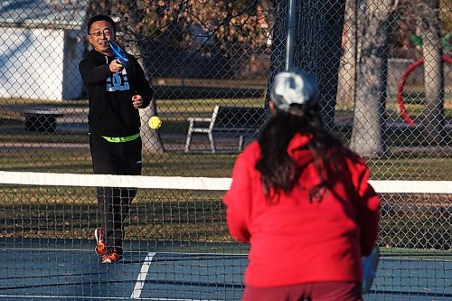 George Chen and Susan Su take advantage of the beautiful weather to play pickleball at the Stanley Park pickleball courts on a warm Wednesday. Environment Canada has forecast warm daytime highs for today and Friday. (Tim Smith/The Brandon Sun)