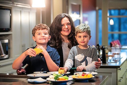 MIKAELA MACKENZIE / FREE PRESS
	
Desirae Mercer and her children, Jacob Reimer (eight) and Zavier Reimer (five), prepare bean tacos on Wednesday, Nov. 13, 2024. Mercer feels that raising her kids vegan helps them to think more about the foods they eat, about where their toys and clothes come from, and their impact on the planet. 

For Janine green page story.
Winnipeg Free Press 2024