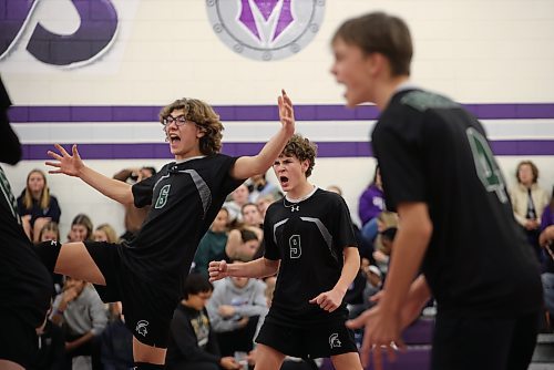 Aiden Moore (6) and Sebastien Shakotko (9) of the Neelin Spartans celebrate a point with teammates during the junior varsity volleyball city championship against the Vincent Massey Vikings at VMHS on Wednesday evening. The Spartans went on to win the championship in five sets. See story on Page B2. (Tim Smith/The Brandon Sun)